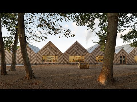 Tracks Architectes design kindergarten in France as a run of pitched forms